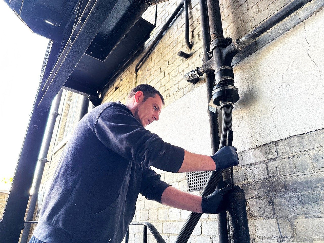 Repairing an external soil pipe