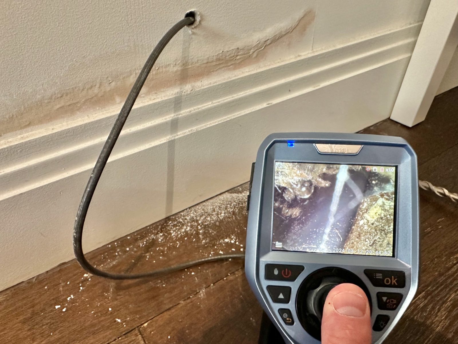 Borescope camera inspecting inside a wall