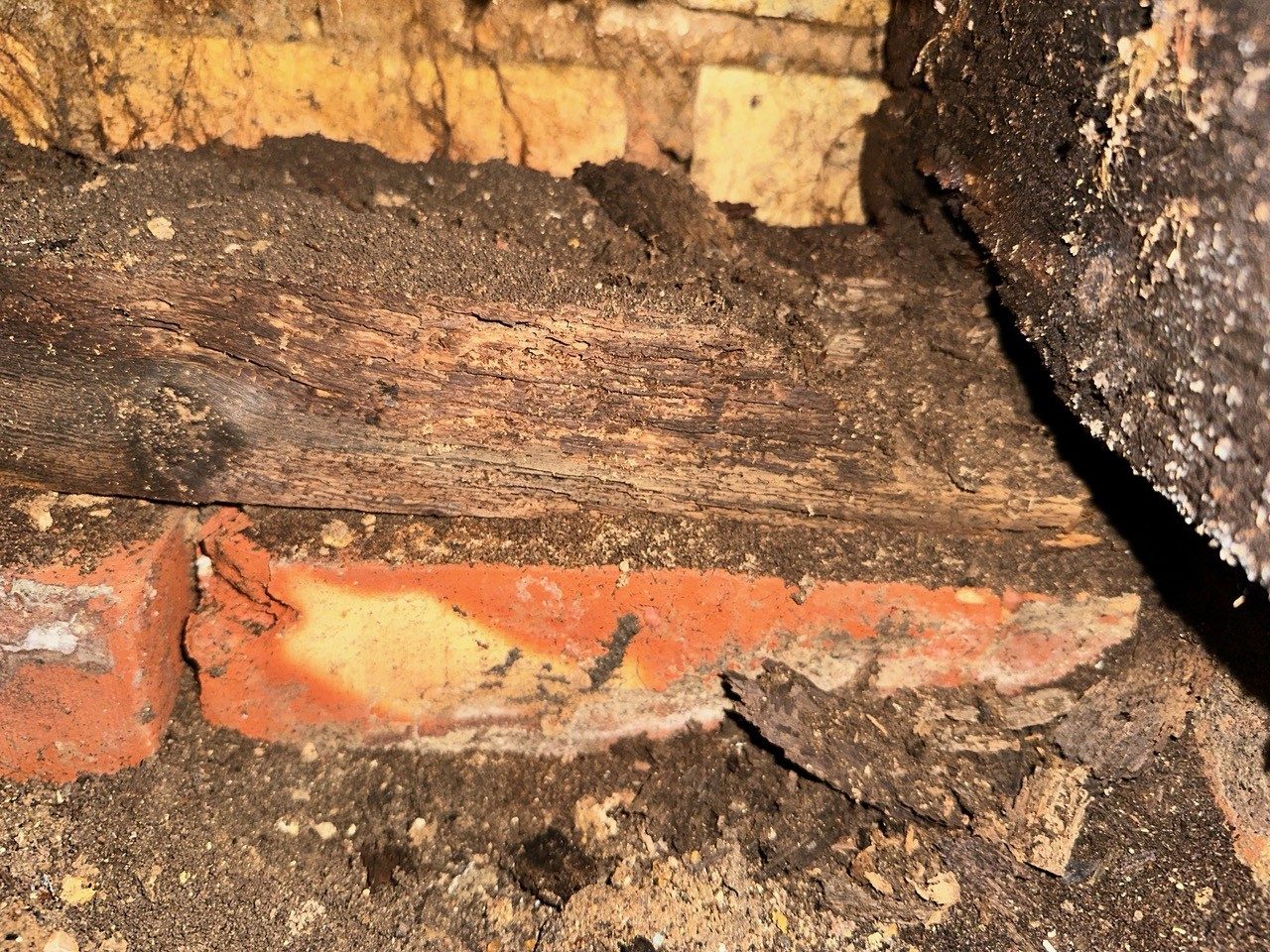Rotten timber on brickwork
