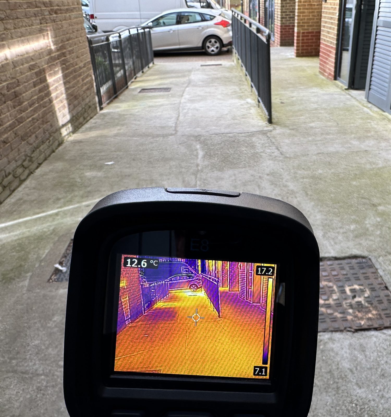 Thermal camera tracing a leak along a passage beside a block
