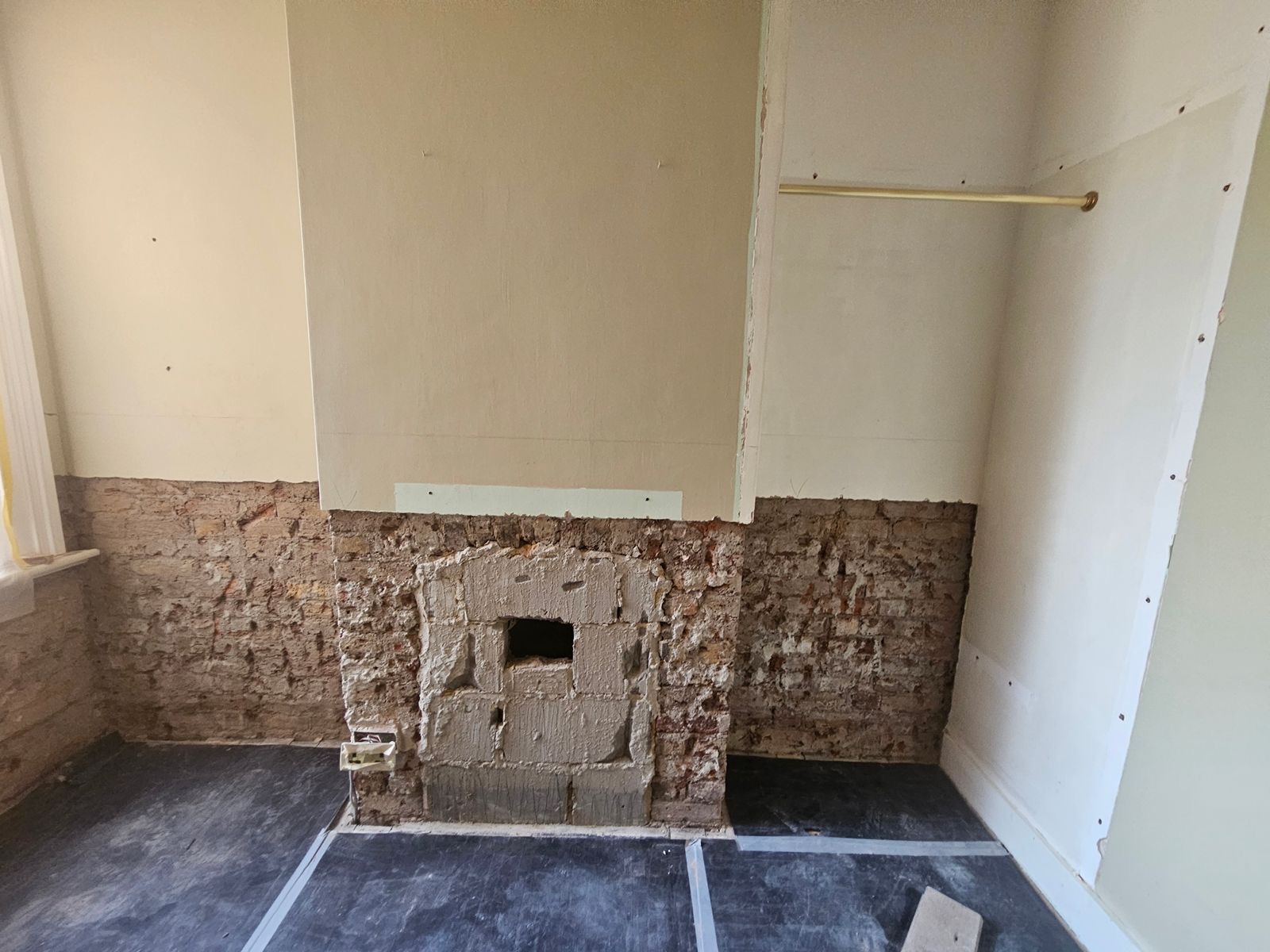 Damp render removed along the lower walls