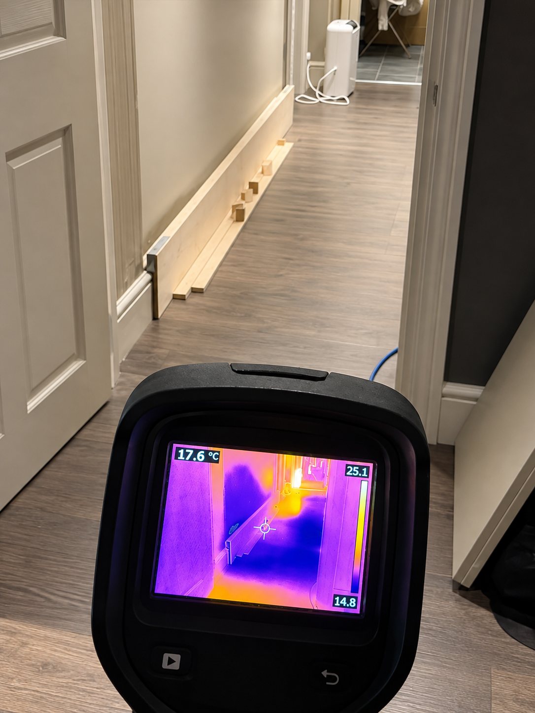 Thermal imaging showing moisture under the hallway floor